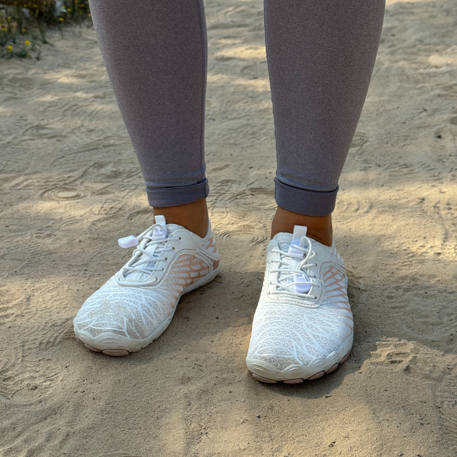 White barefoot shoes worn outdoors